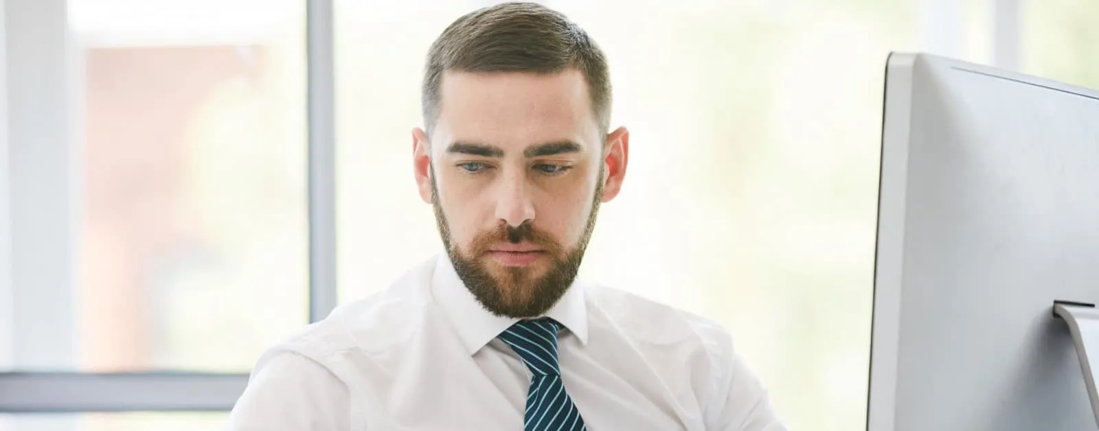 AML compliance officer reviewing transaction data to detect suspicious financial activity