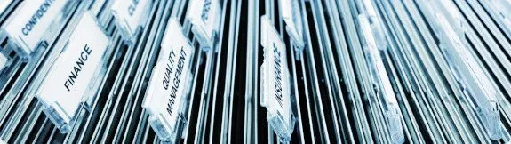 Compliance analyst conducting AML records review to identify discrepancies and ensure regulatory adherence