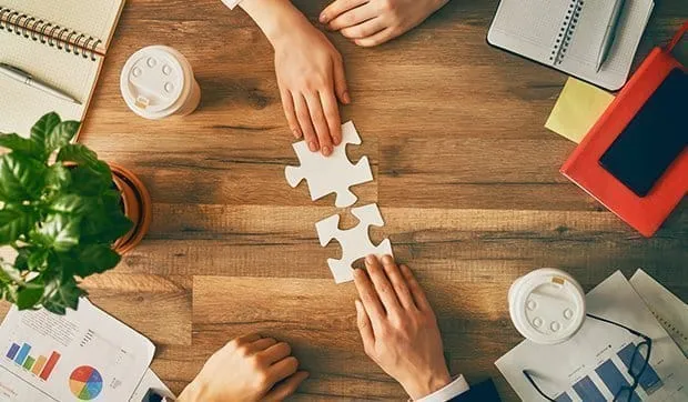 Business consultants presenting tailored M&A services to potential clients.
