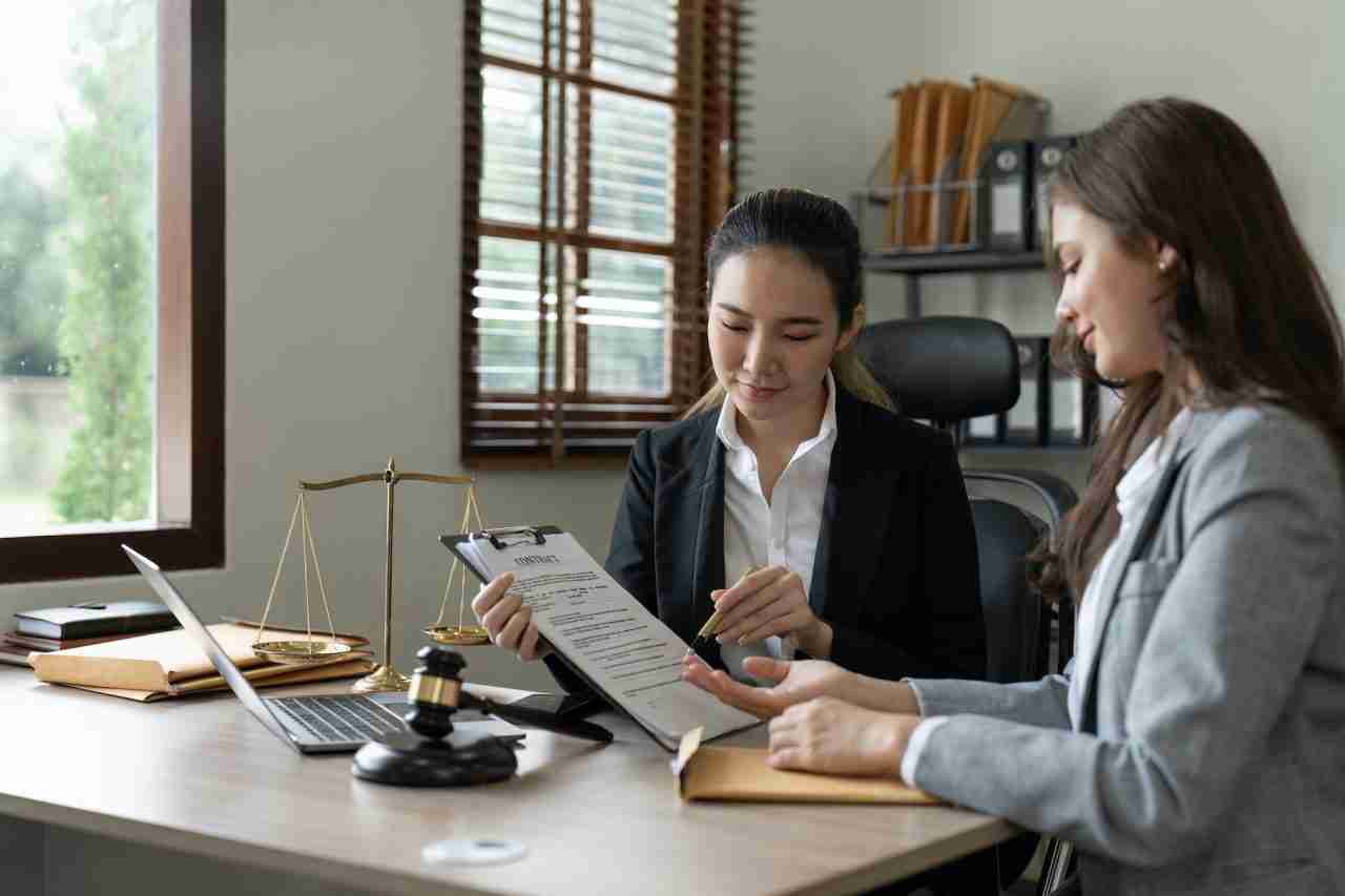 Businesswoman consulting with female lawyer at N R Doshi & Partners office in Dubai, UAE — expert advisory and audit services.